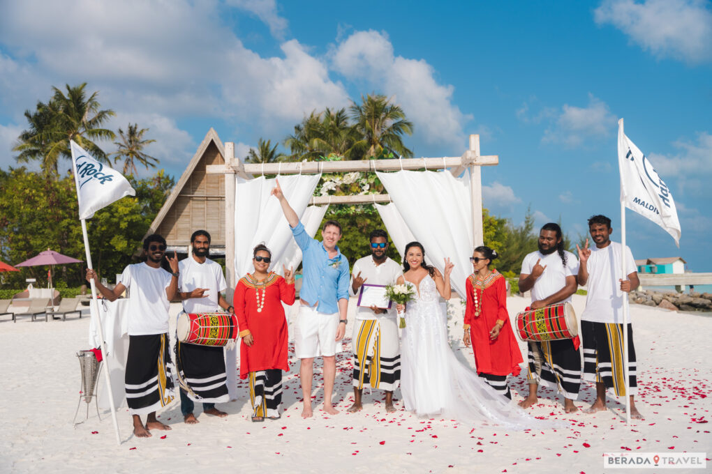 Master of Ceremony holding the symbolic wedding certificate